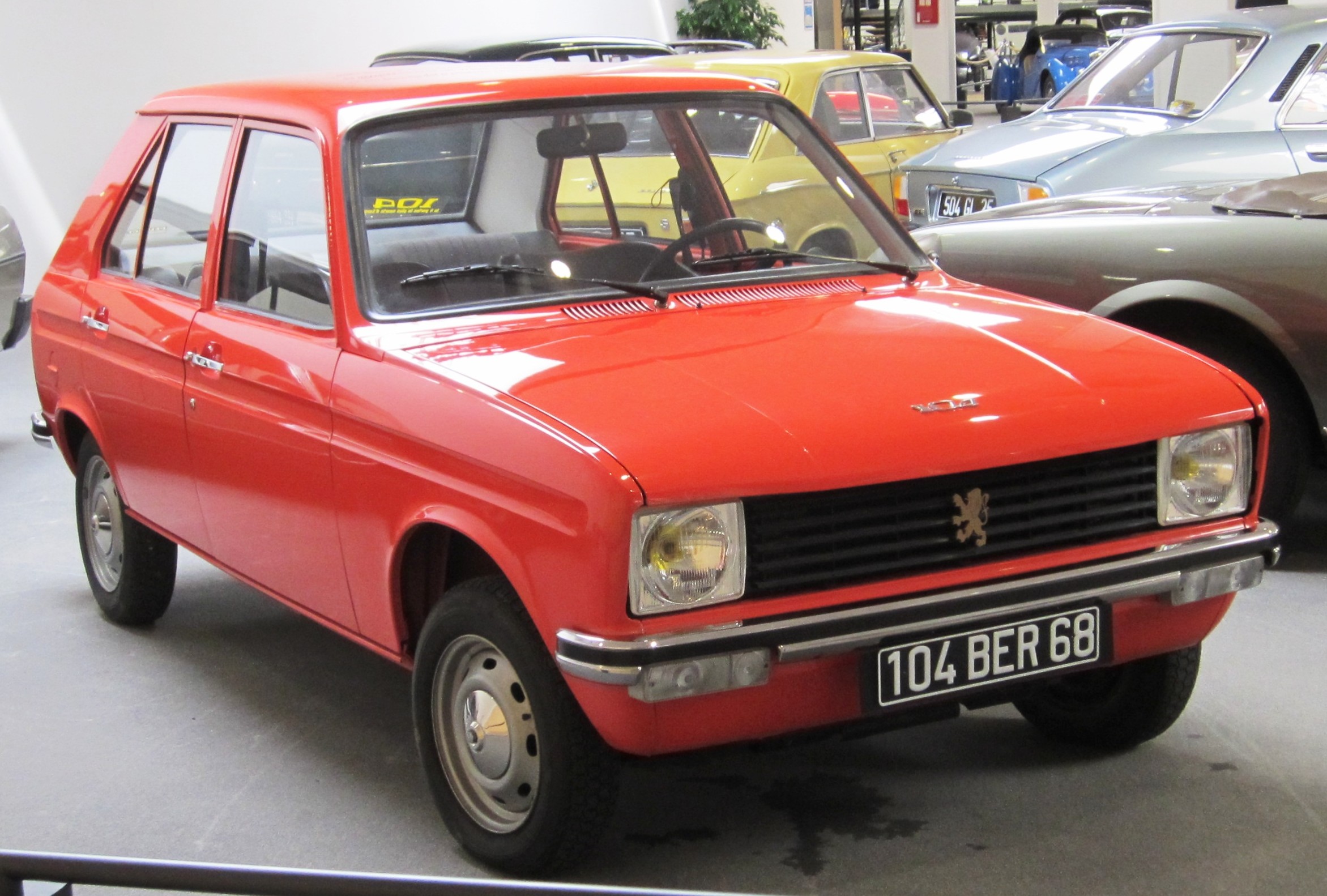 orange avd Peugeot 104 early one at the Peugeot Museum